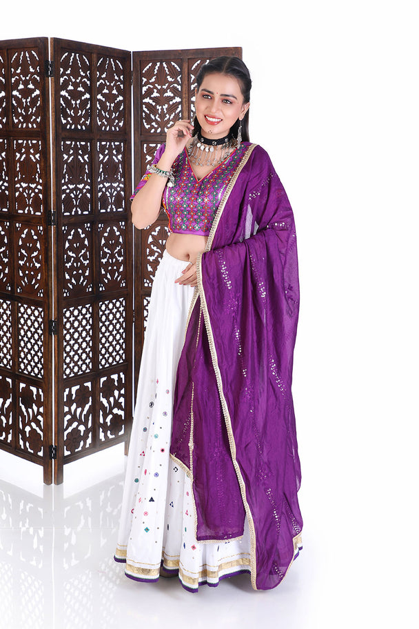 vibrant purple silk blouse & white mirror work lehenga set