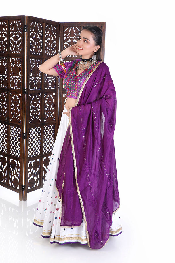 vibrant purple silk blouse & white mirror work lehenga set