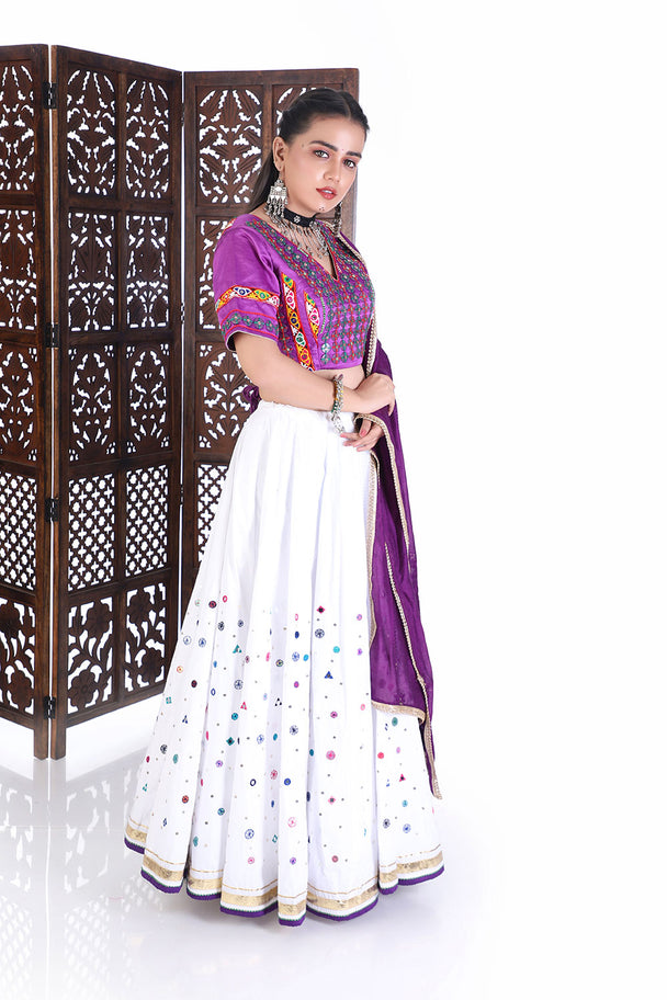 vibrant purple silk blouse & white mirror work lehenga set