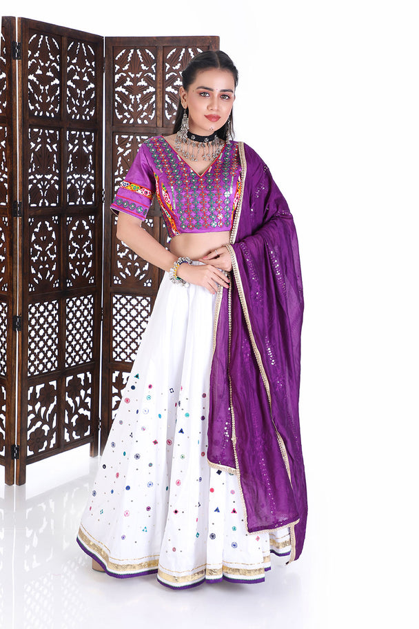 vibrant purple silk blouse & white mirror work lehenga set