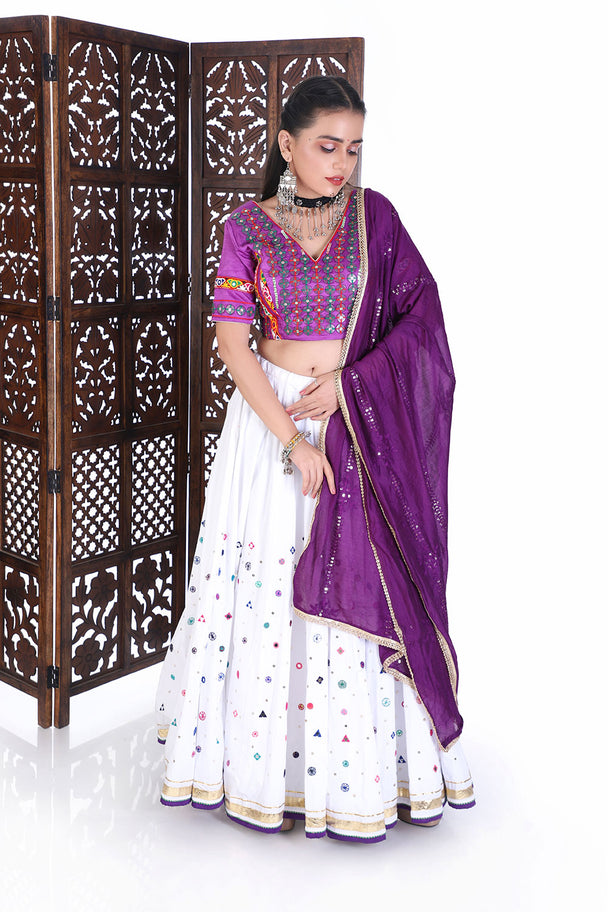 vibrant purple silk blouse & white mirror work lehenga set