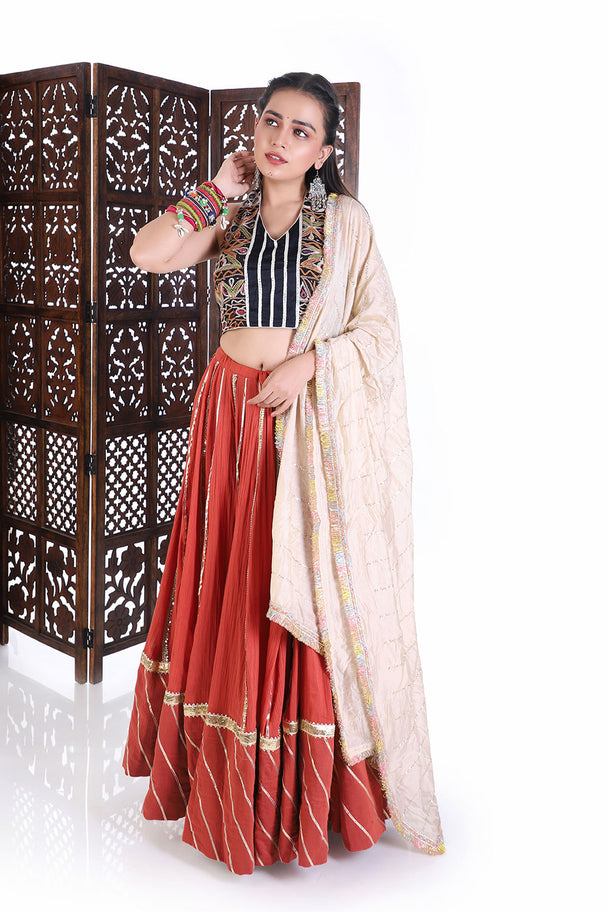 traditional navratri chaniya choli set - embroidered halter neck blouse & rust flared lehenga for weddings & festivals
