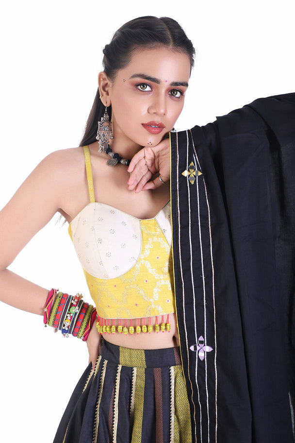 bold yellow tassel choli with lehenga and black mirror dupatta