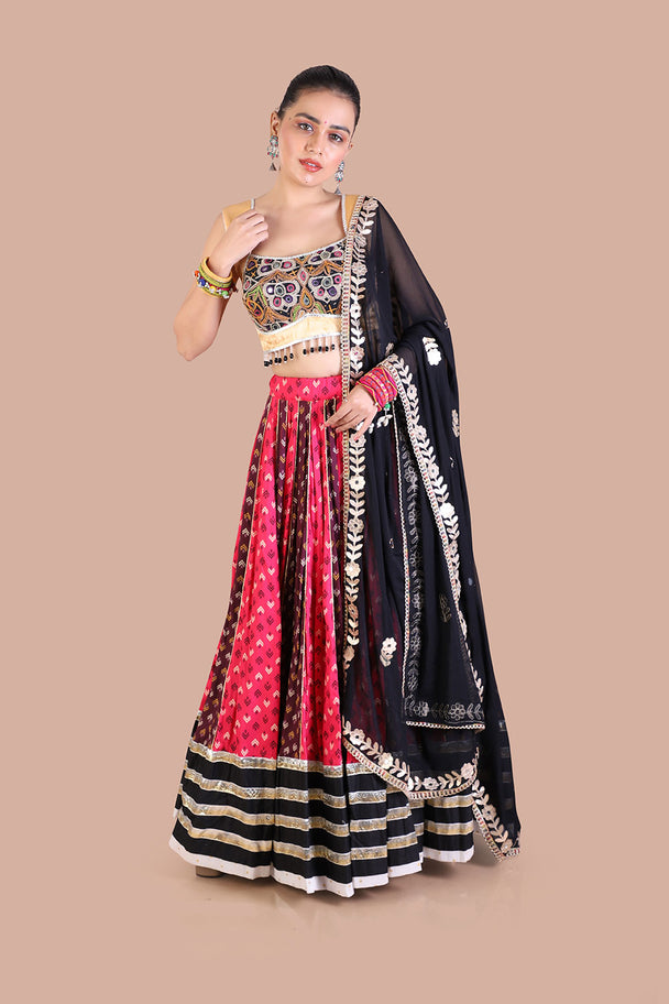 traditional print lehenga with gold blouse contrasting black dupatta for navratri festive