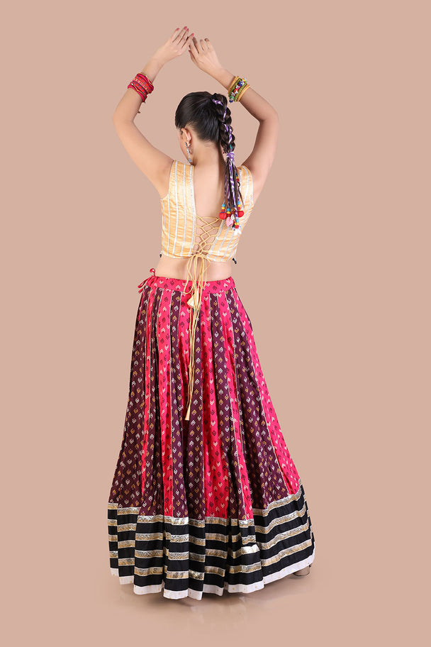 traditional print lehenga with gold blouse contrasting black dupatta for navratri festive