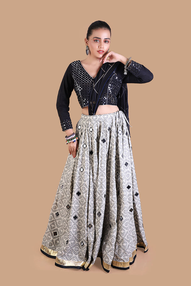black embroidered blouse with silver mirror work lehenga