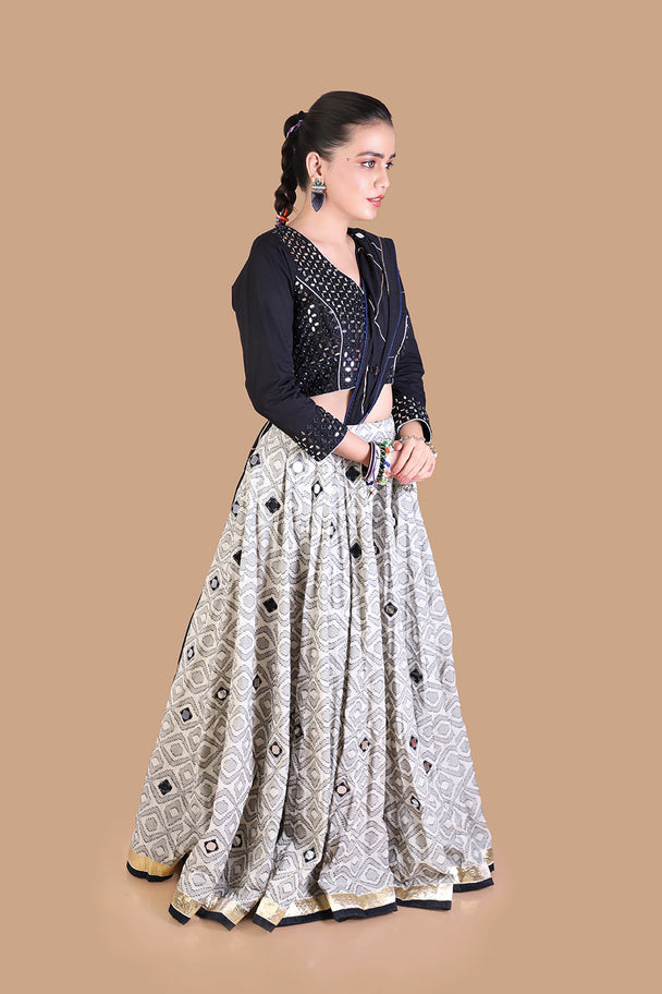 black embroidered blouse with silver mirror work lehenga