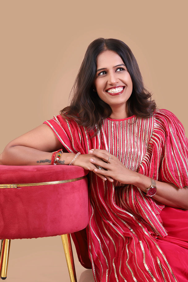 coral red striped tunic with matching flared palazzo pants
