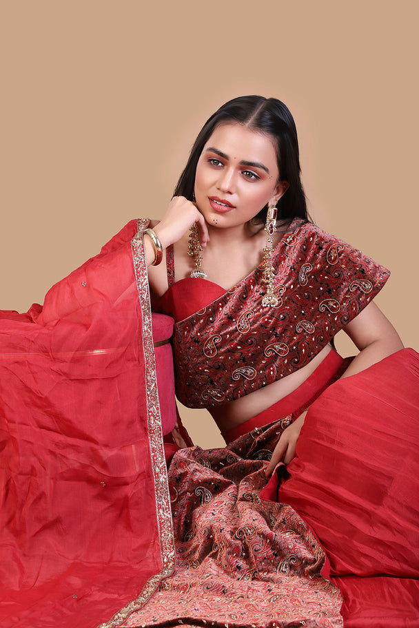 red embroidered lehenga with maroon blouse & draped dupatta