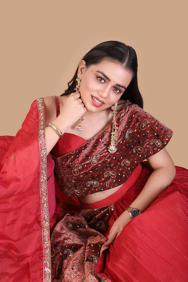 red embroidered lehenga with maroon blouse & draped dupatta
