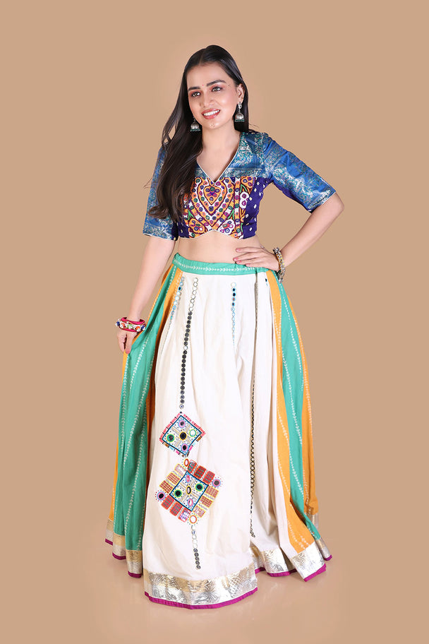 white flared lehenga with multicolor striped panels & blue embroidered blouse