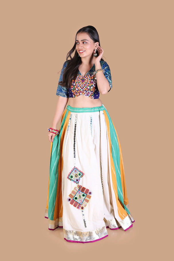 white flared lehenga with multicolor striped panels & blue embroidered blouse