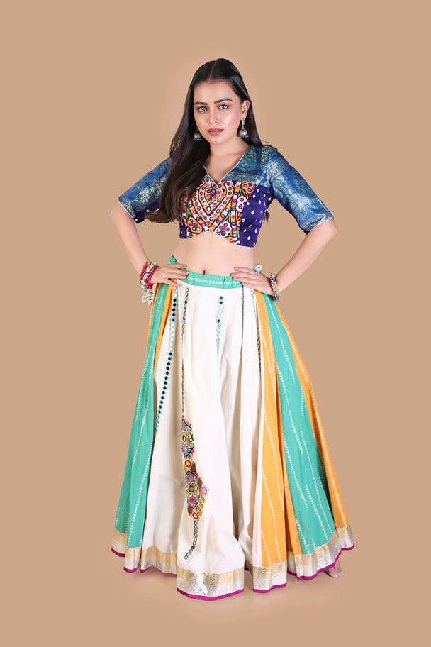 white flared lehenga with multicolor striped panels & blue embroidered blouse