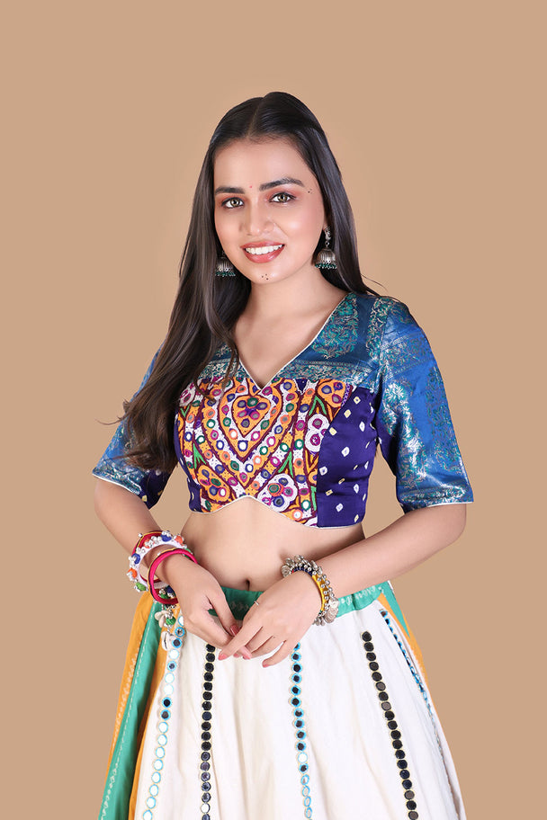 white flared lehenga with multicolor striped panels & blue embroidered blouse