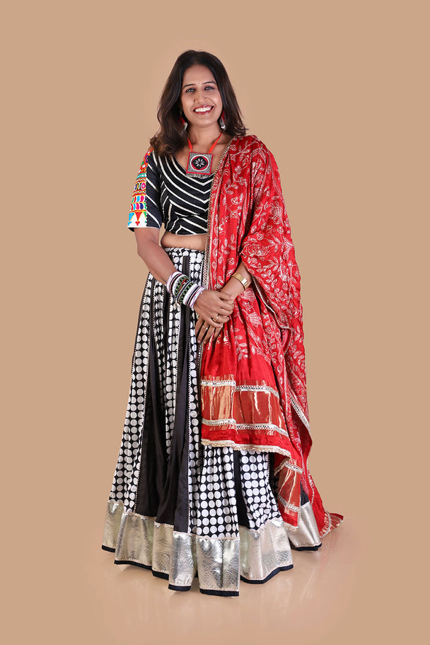 black & white printed lehenga with red printed dupatta