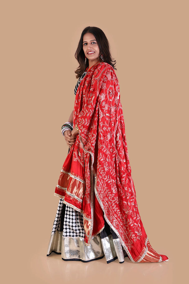 black & white printed lehenga with red printed dupatta