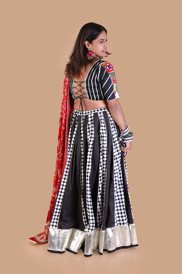 black & white printed lehenga with red printed dupatta