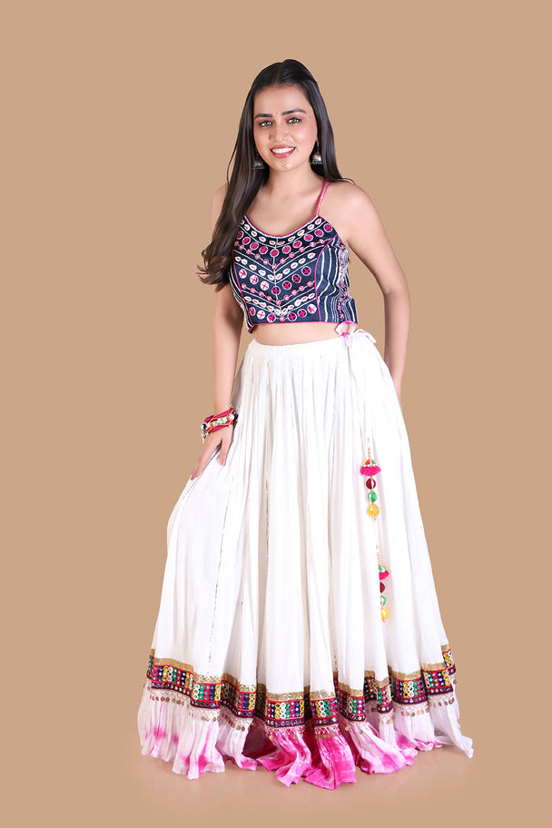 ivory lehenga with embroidered blouse & pink tassel border
