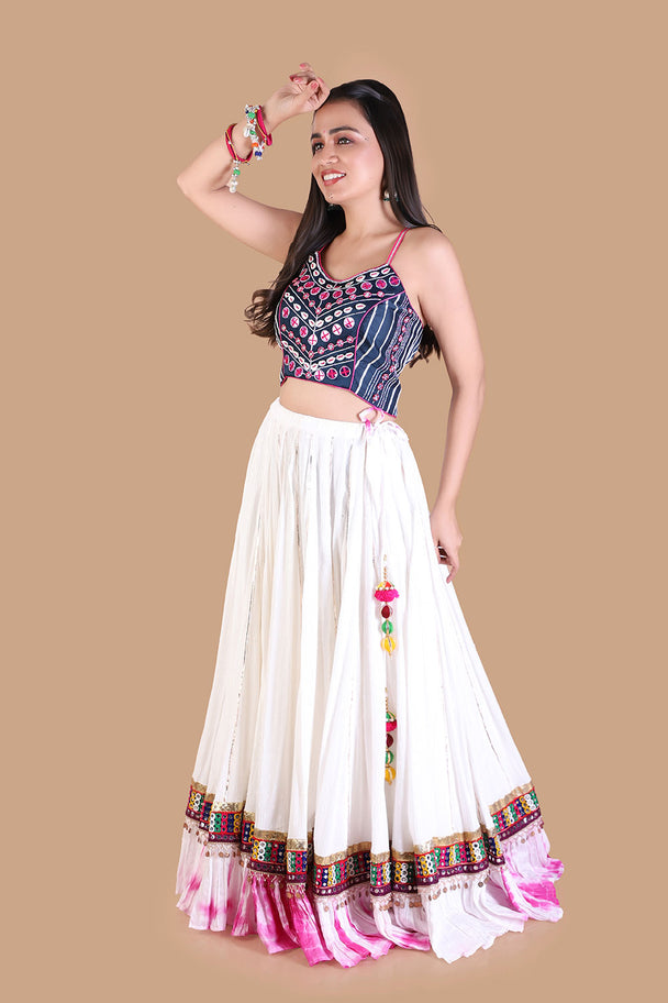 ivory lehenga with embroidered blouse & pink tassel border