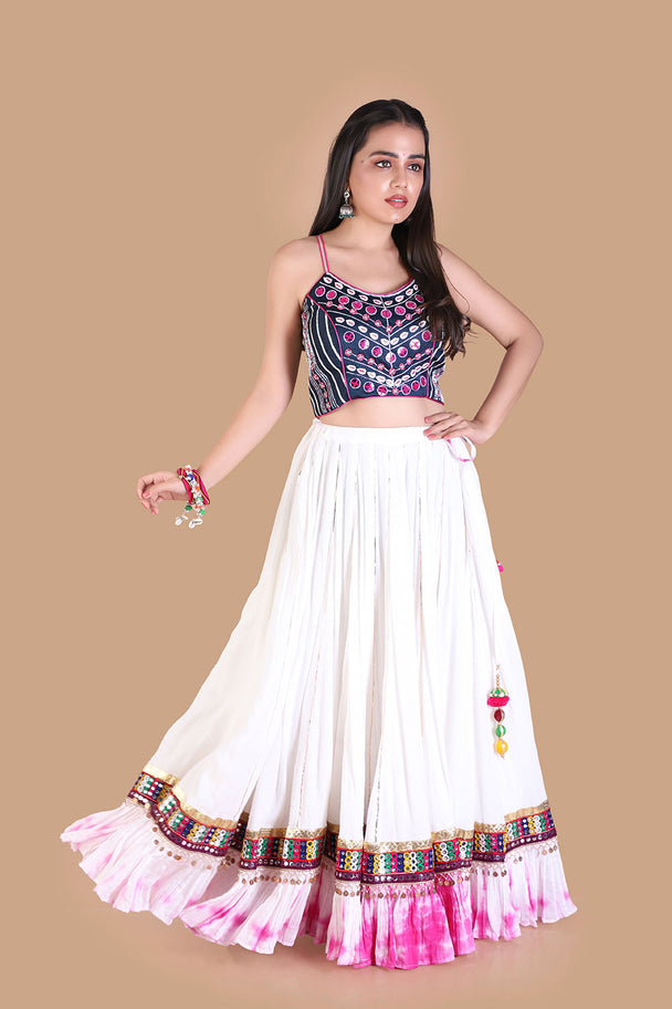 ivory lehenga with embroidered blouse & pink tassel border