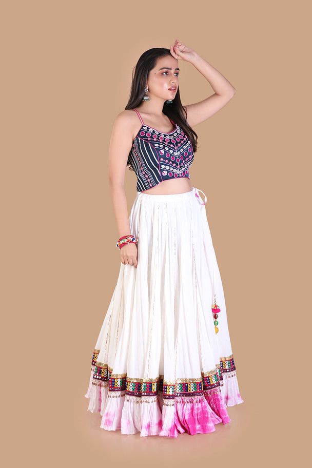 ivory lehenga with embroidered blouse & pink tassel border