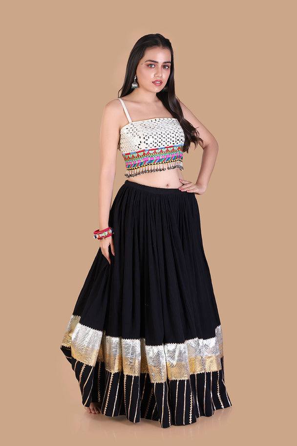 black flared lehenga with multicolor embroidered blouse & metallic border