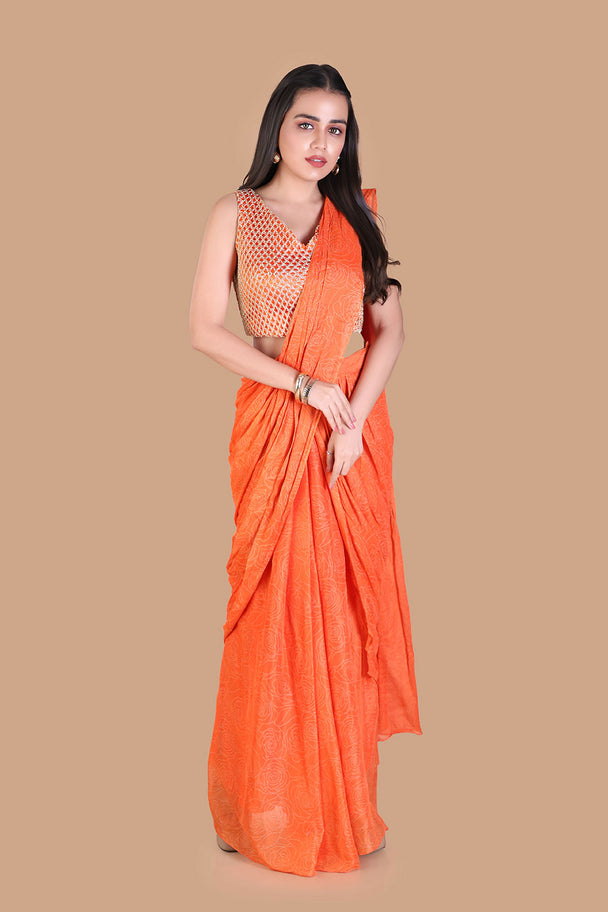 vibrant orange saree with textured embroidered blouse