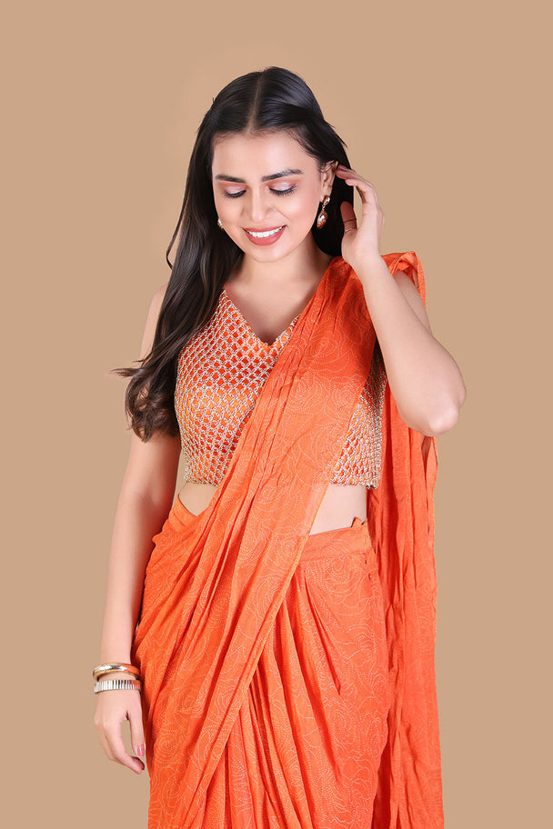 vibrant orange saree with textured embroidered blouse