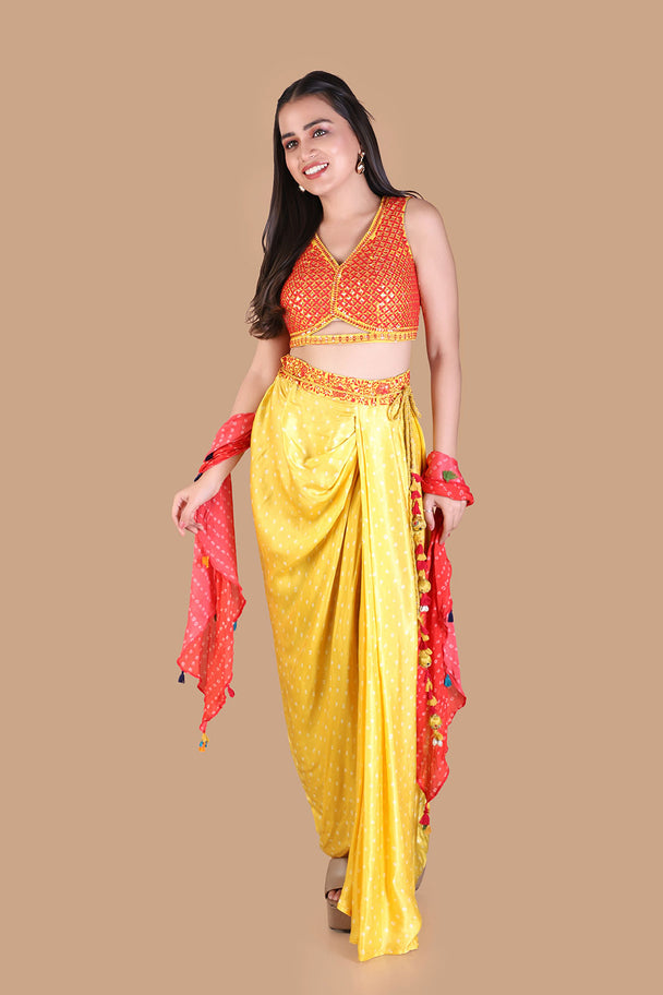 yellow draped dhoti pants with embroidered orange blouse & pink dupatta