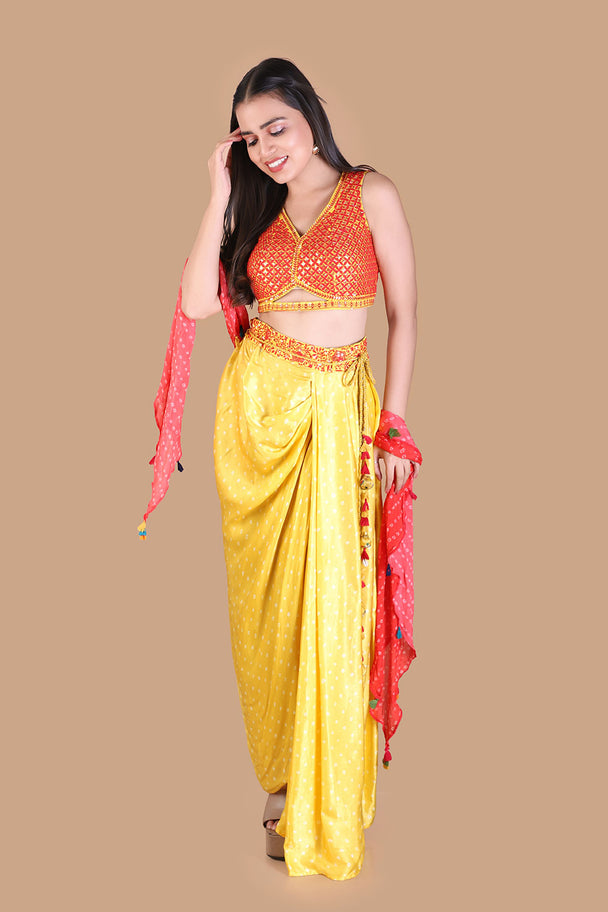 yellow draped dhoti pants with embroidered orange blouse & pink dupatta