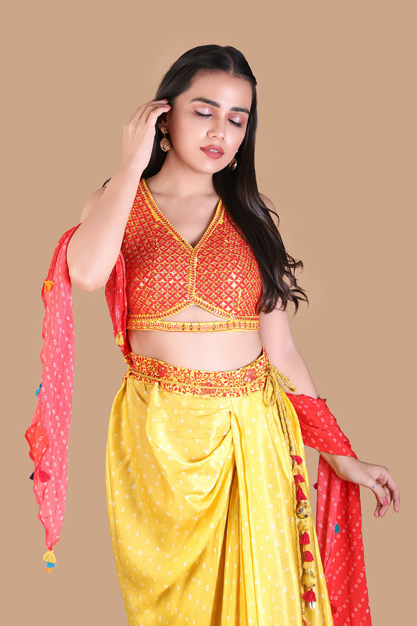 yellow draped dhoti pants with embroidered orange blouse & pink dupatta
