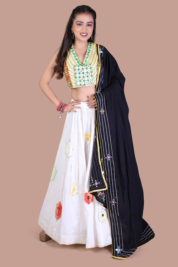ivory floral lehenga with green blouse & black dupatta
