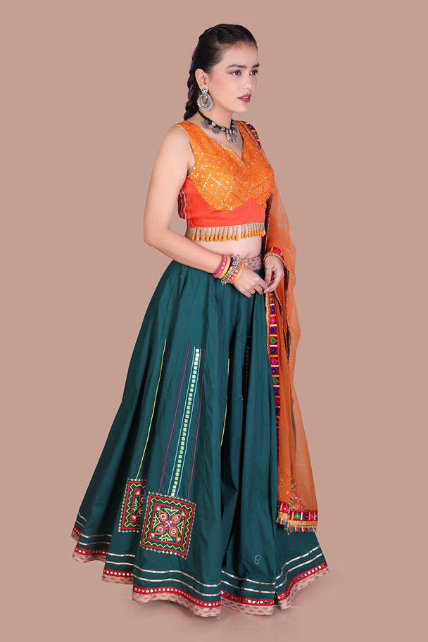 teal green lehenga with orange blouse & mustard dupatta