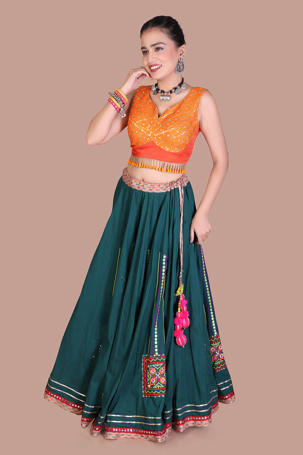 teal green lehenga with orange blouse & mustard dupatta