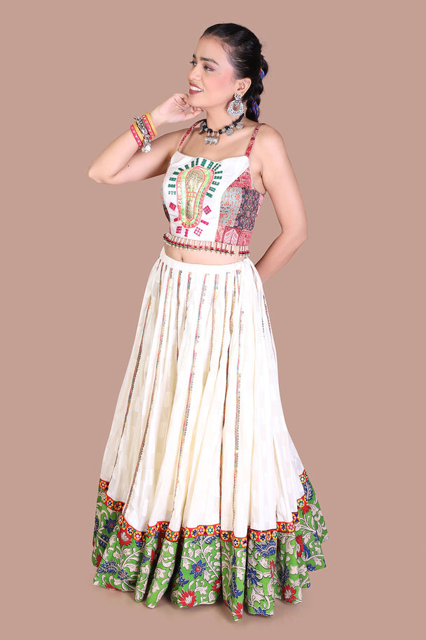 ivory floral lehenga with embroidered blouse & green printed border