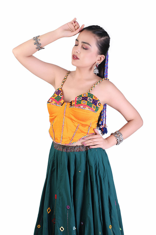 deep teal lehenga with orange blouse & mustard dupatta
