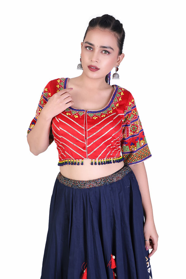 navy blue lehenga with red striped blouse