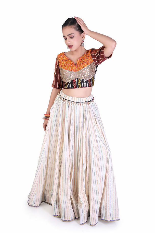 ivory lehenga with orange embroidered blouse & coordinated dupatta