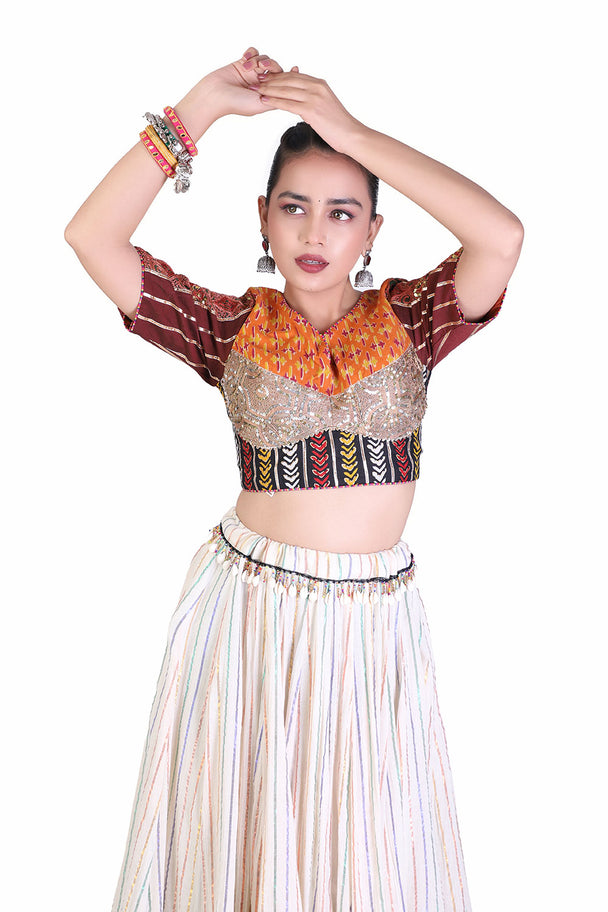 ivory lehenga with orange embroidered blouse & coordinated dupatta