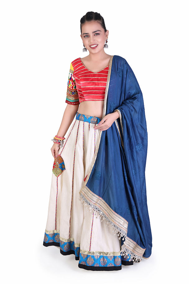 ivory lehenga with red striped blouse & blue dupatta
