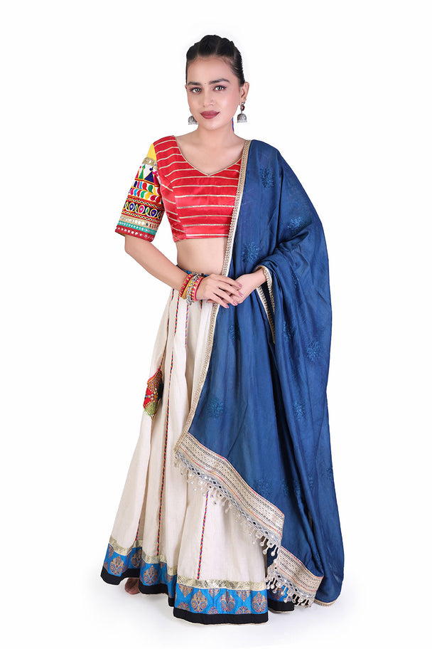 ivory lehenga with red striped blouse & blue dupatta