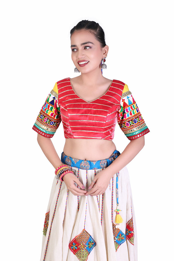 ivory lehenga with red striped blouse & blue dupatta